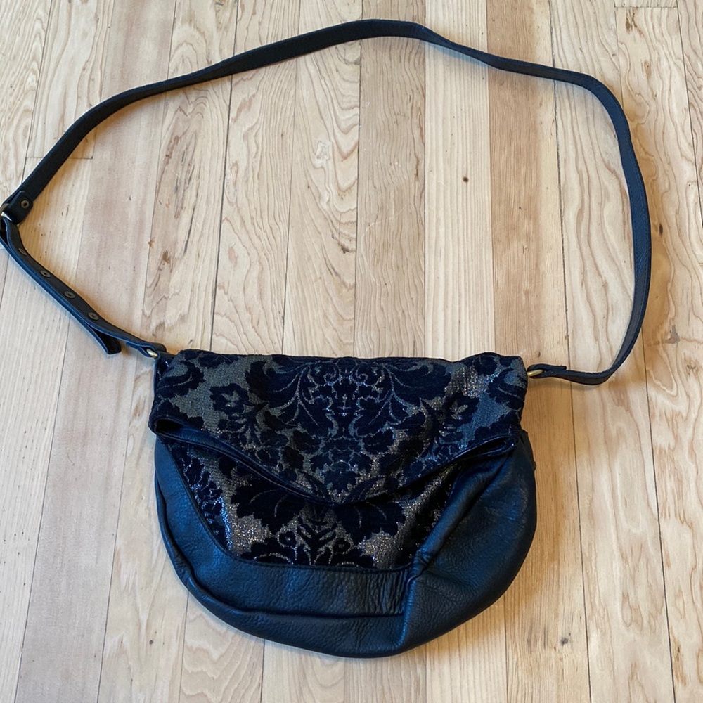 Motif 56 Black leather crossbody purse.